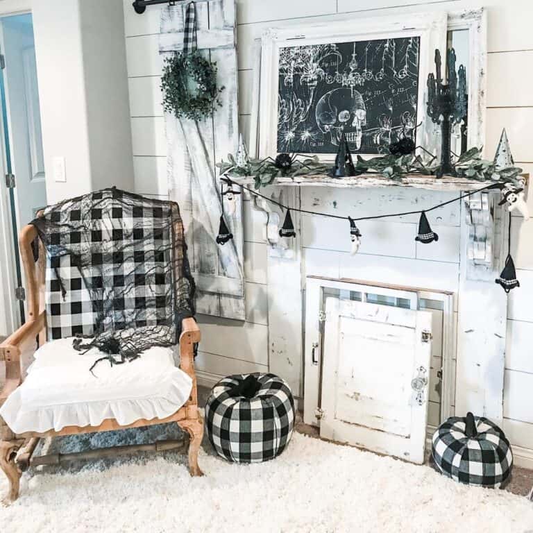 White Shiplap Fireplace with Black Halloween Decorations