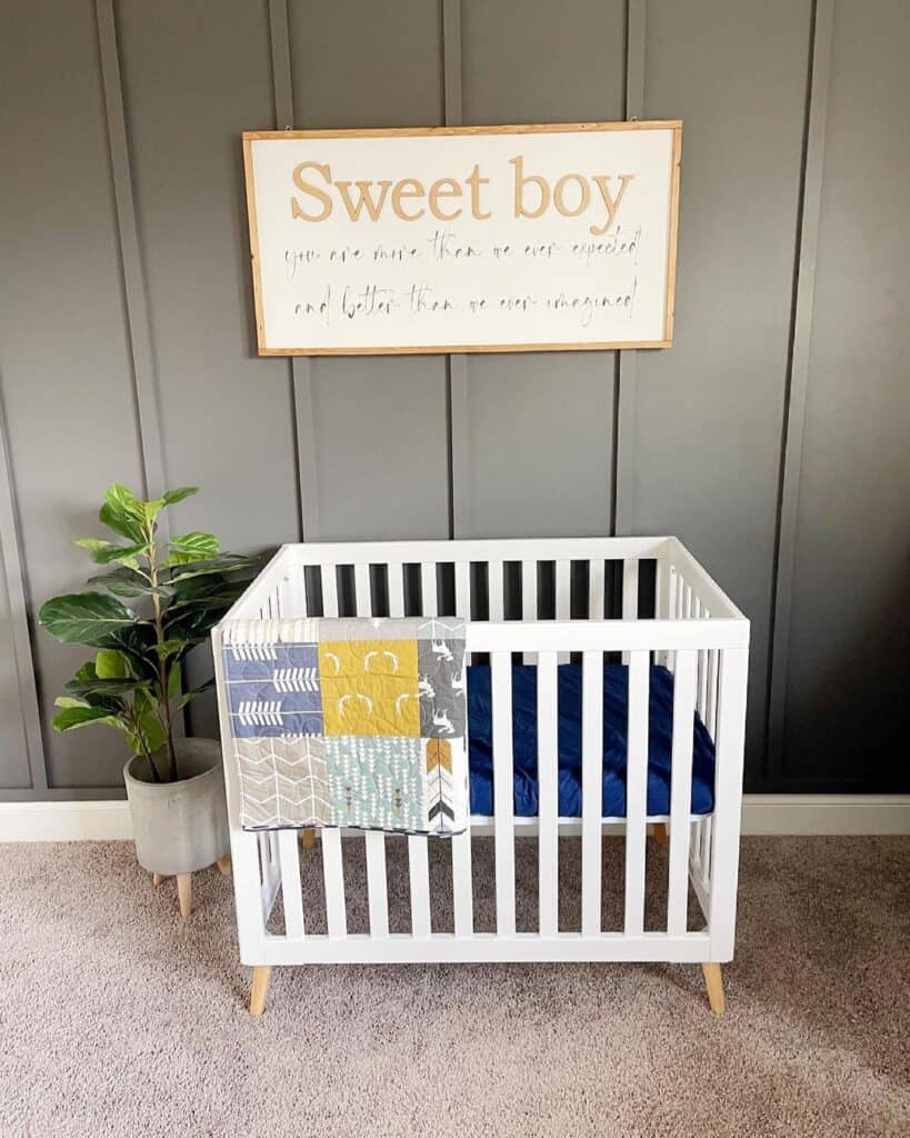 White Spindle Crib in Boy Nursery