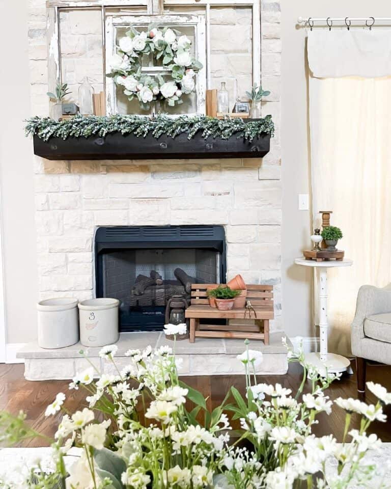 White Stone Fireplace with Black Mantel Shelf