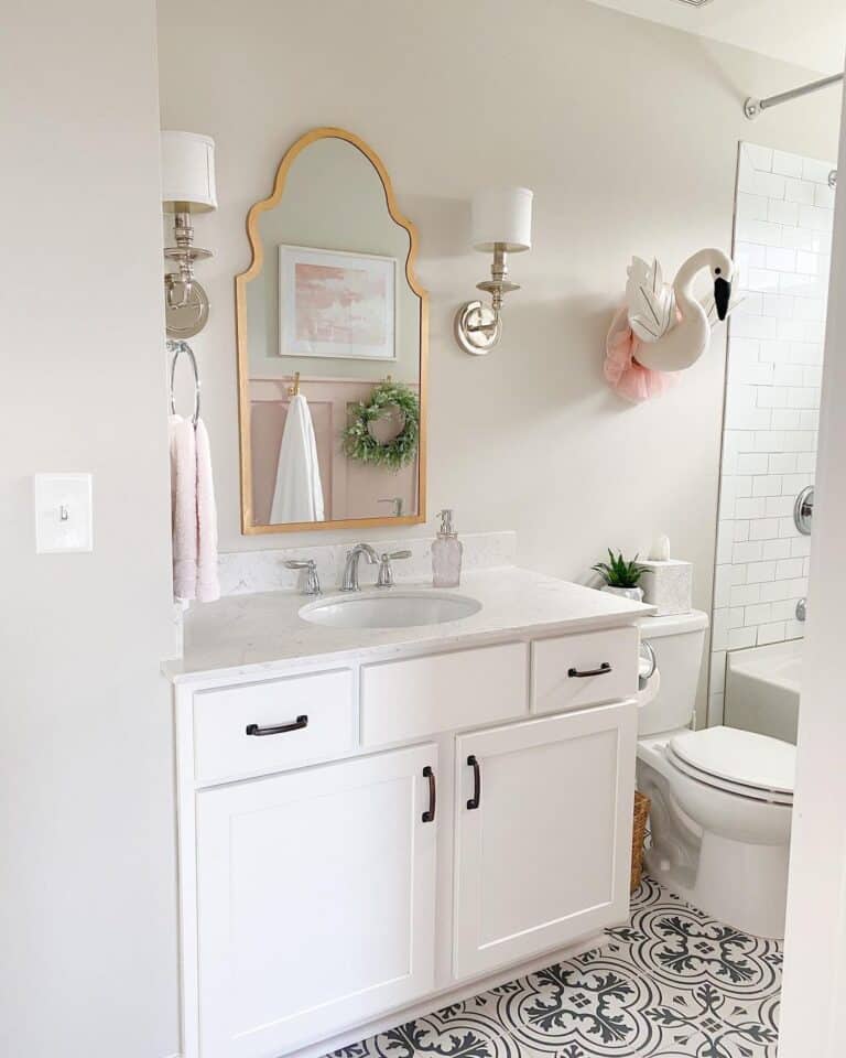 White Vanity Beneath Shaded Sconces