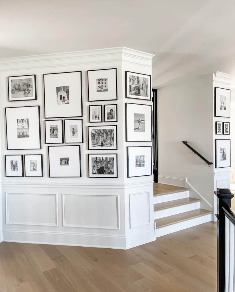 White Wainscoting Beneath Asymmetrical Gallery Wall