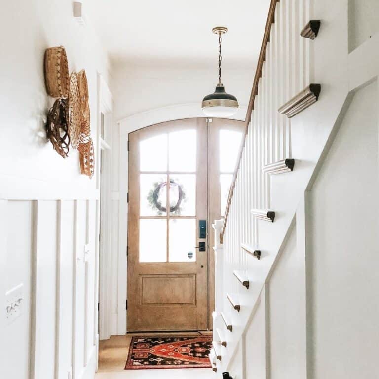 White and Wood Entryway with Staircase
