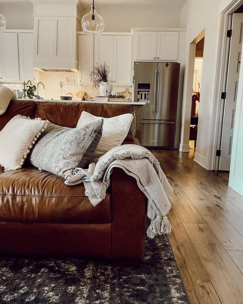 Wood Flooring and Brown Leather Sofa