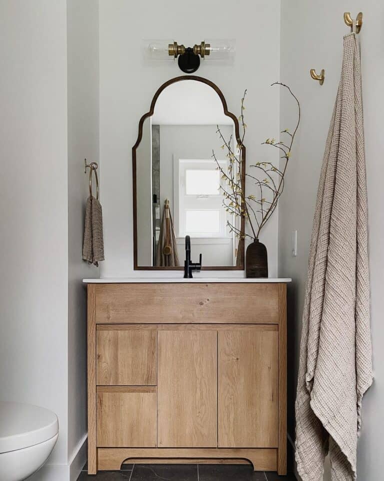 Wooden Bathroom Vanity Tucked in Corner