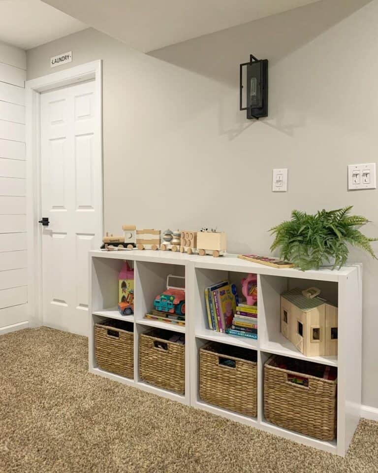 Wooden Train on a White Playroom Storage Unit