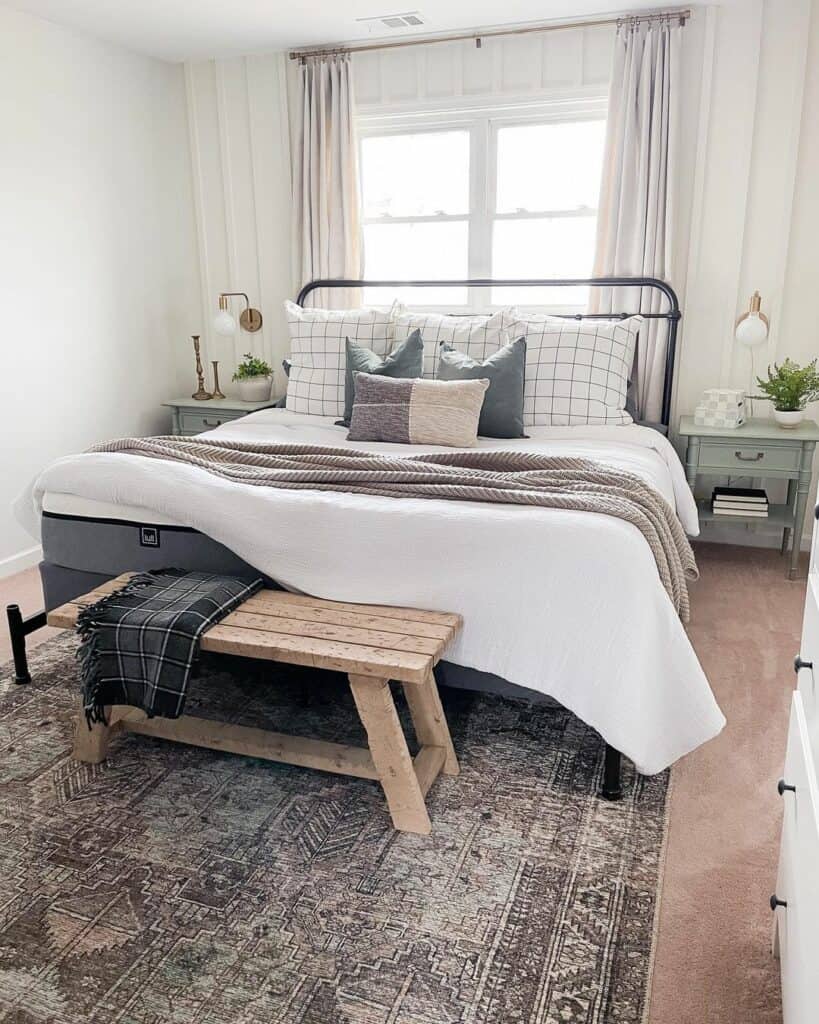 A Black and Grey Plaid Blanket on a Rustic Wood Bench