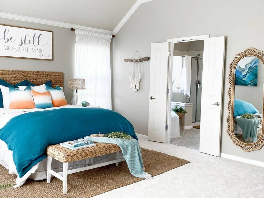 A Bright Blue Blanket and the Wicker Seat of a White Bench