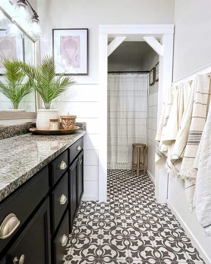 A Decorative Tile Floor with Black Cabinets