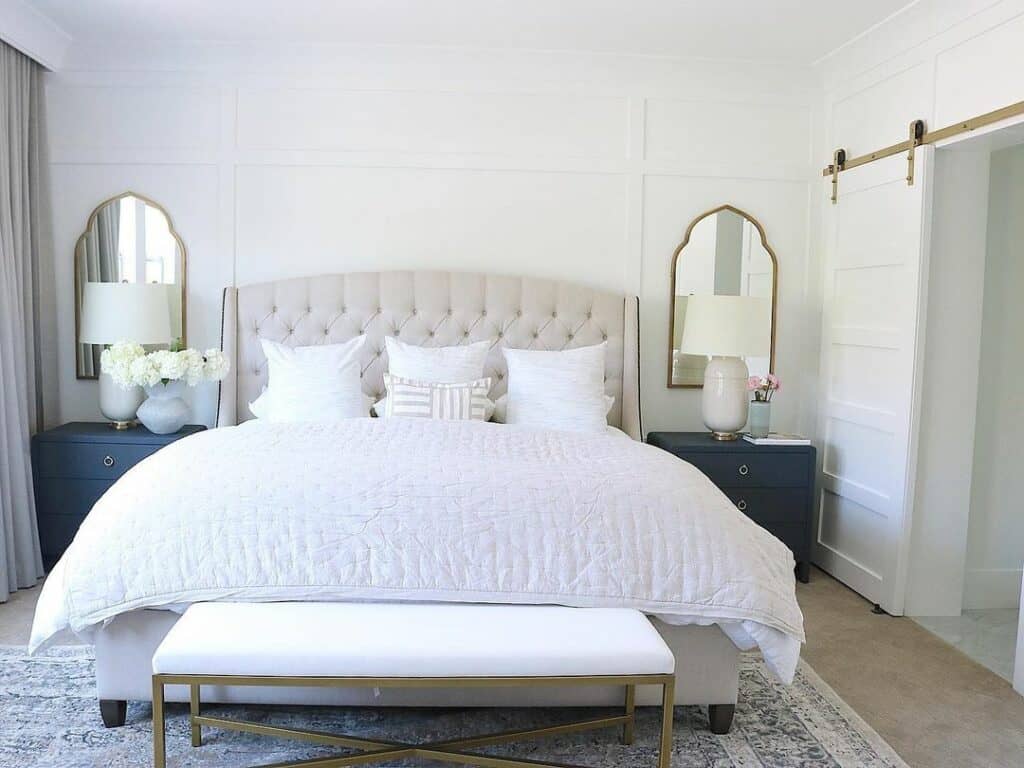 Arched Brass Mirrors Behind Lamps on Nightstands