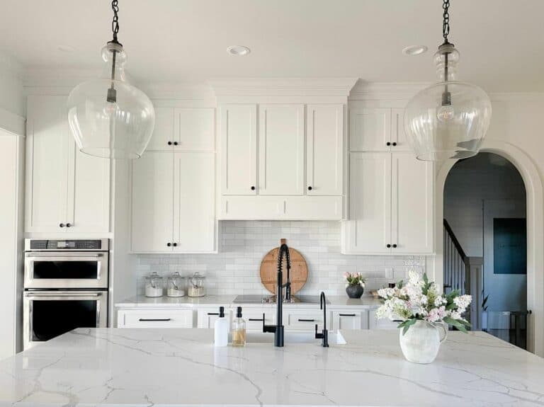 Arched Doorway into Marble Island Kitchen