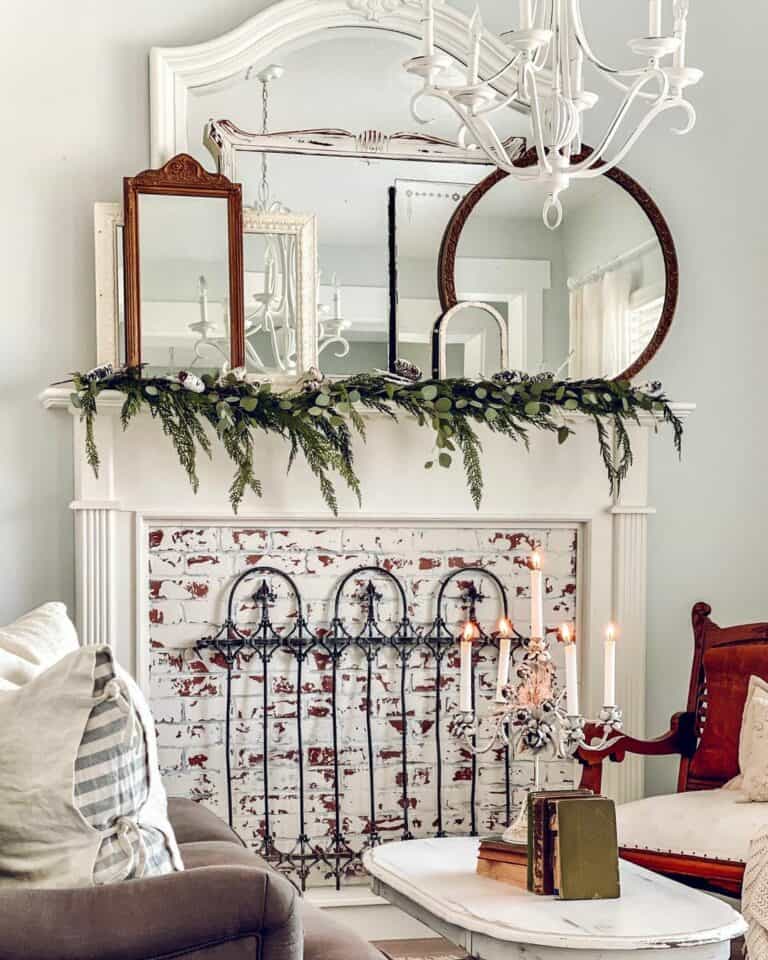 Assortment of Mirrors and Evergreen Branches