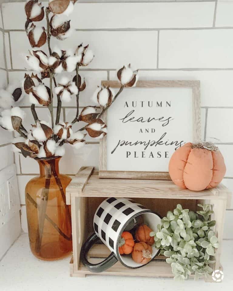 Autumn Leaves and Pumpkins in Wooden Crate