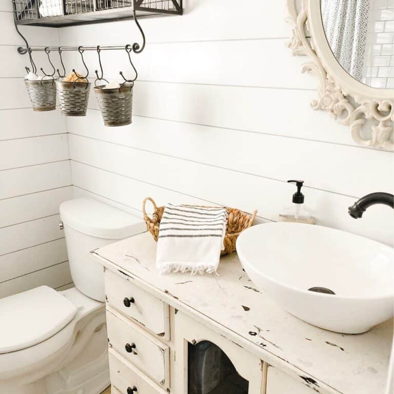 Bathroom With Shiplap Walls and a Rustic Vanity