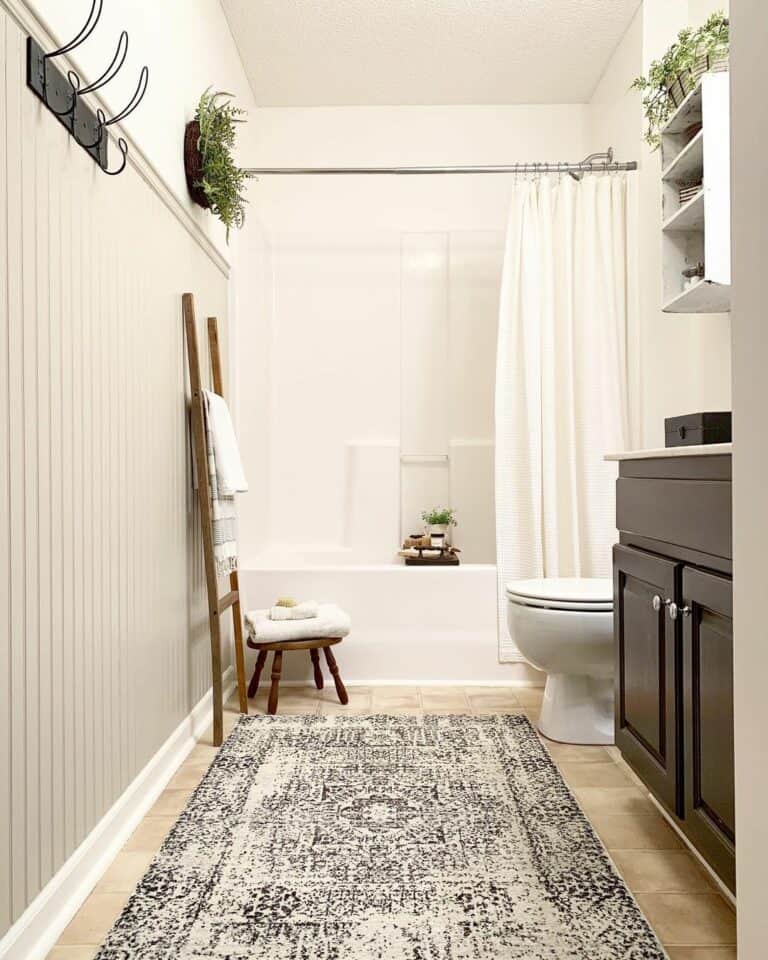 Bathroom with Black Vanity and Wooden Towel Ladder