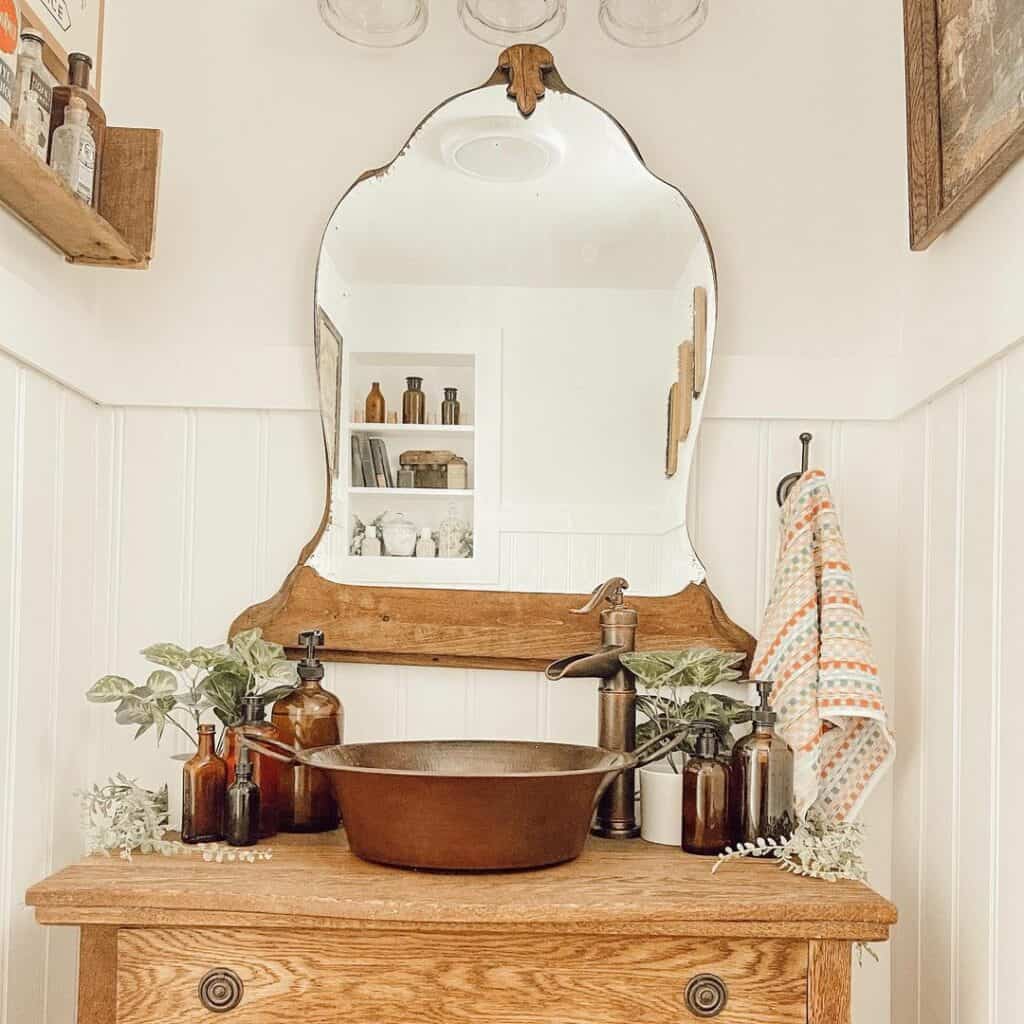 Bathroom with Repurposed Dresser and Bronze Sink Soul & Lane