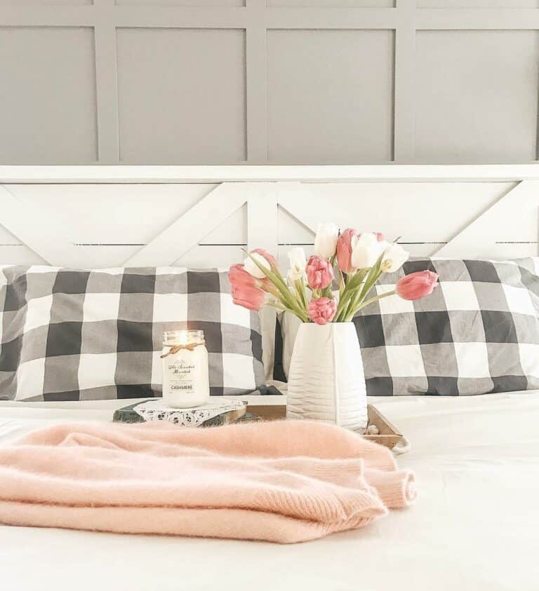 Bed with Pink Flowers and Throw Blanket