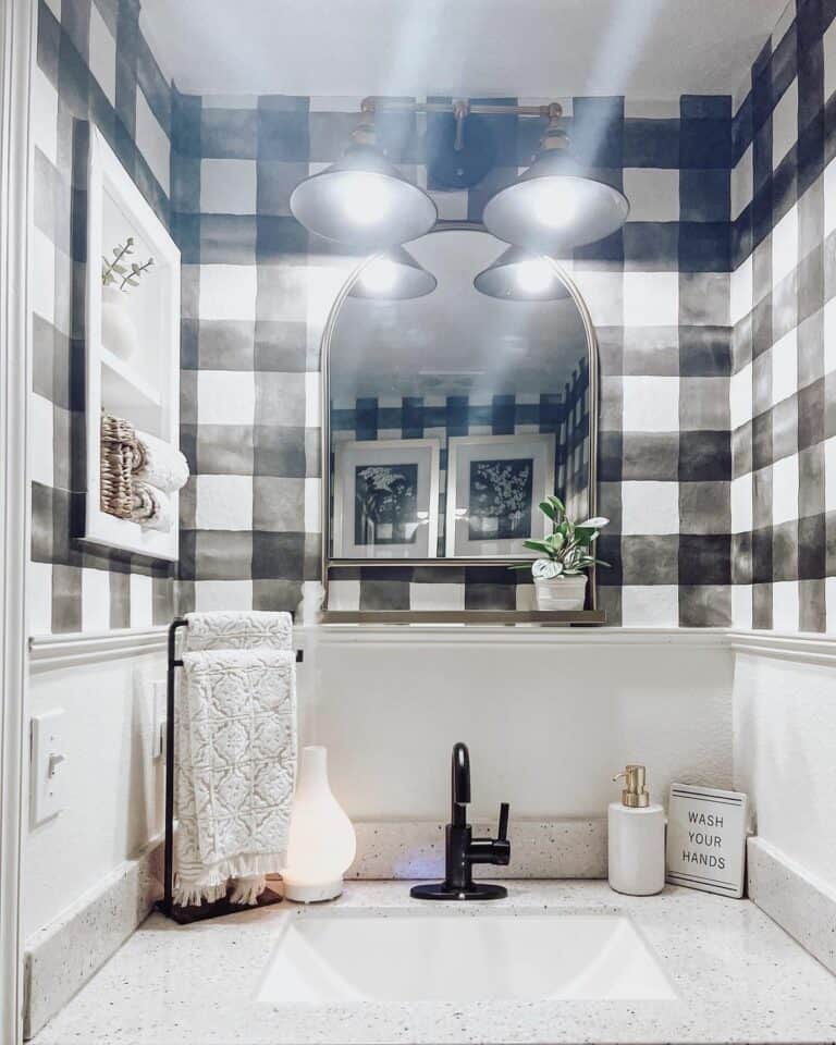Black And White Patterned Wallpaper Lit By Pendant