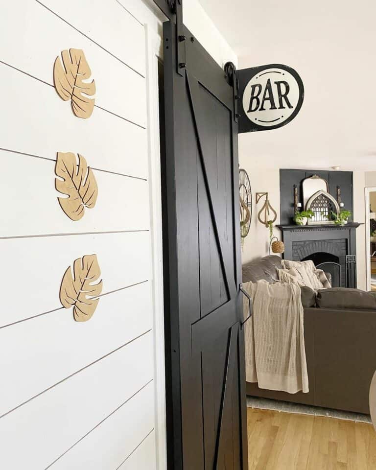 Black Barn Door on White Shiplap Wall
