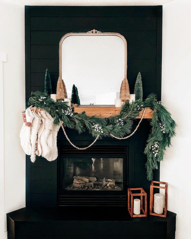 Black Fireplace Contrasts a White Wall