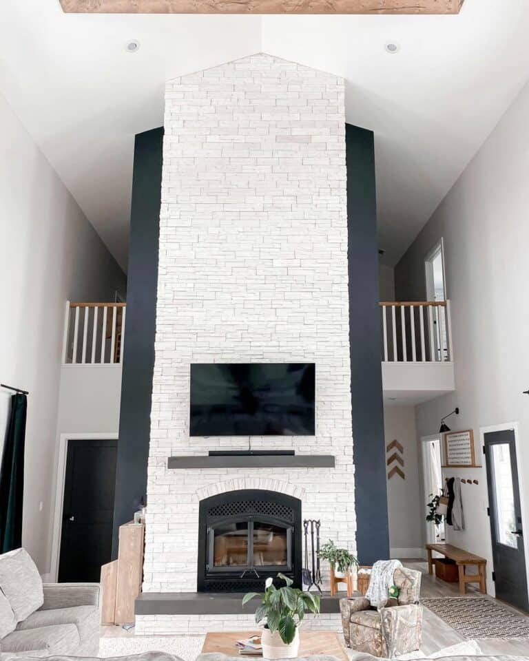 Black Fireplace with White Stone Wall