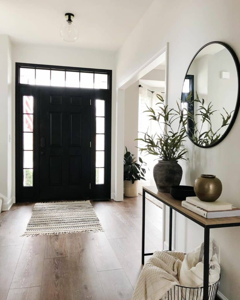 Black Front Door With Sidelights and a Transom in a White Entryway