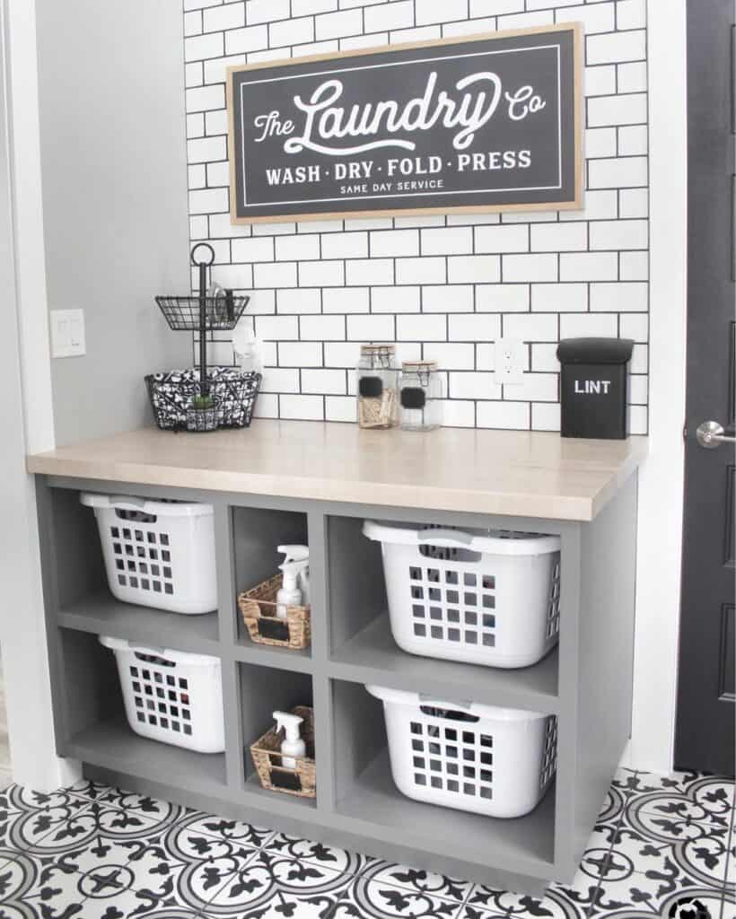 Black Laundry Room Sign on a White Subway Tile Wall