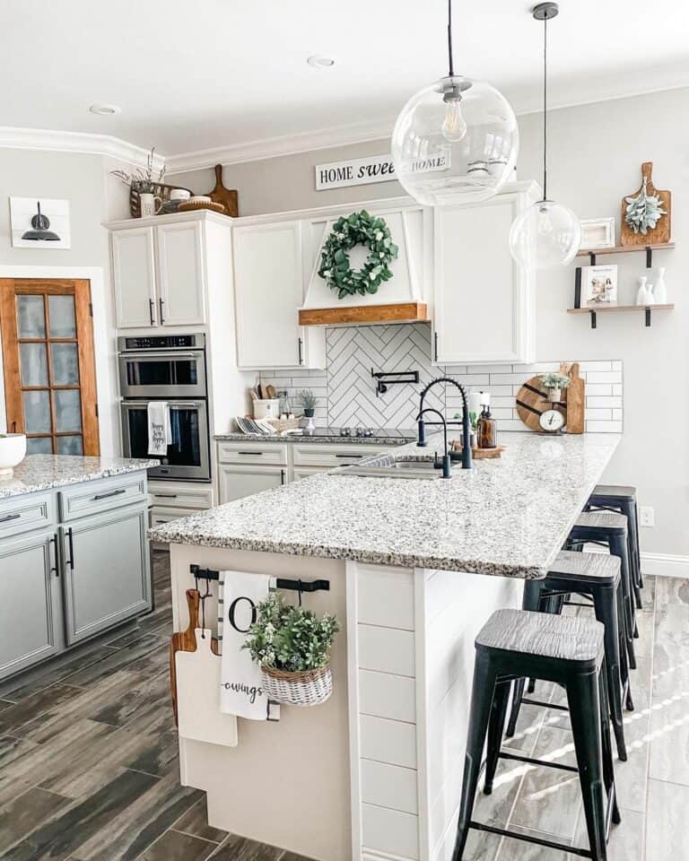 Black Metal Bar Stools Under Ball-Shaped Pendant