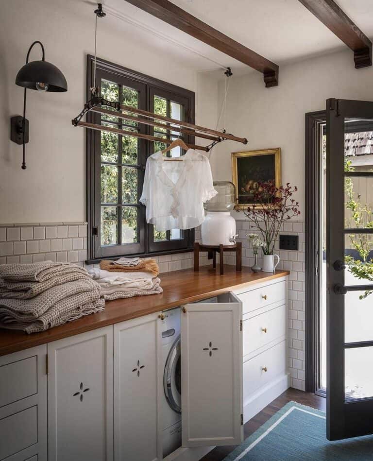 Black Sconce Over a White Tiled Backsplash