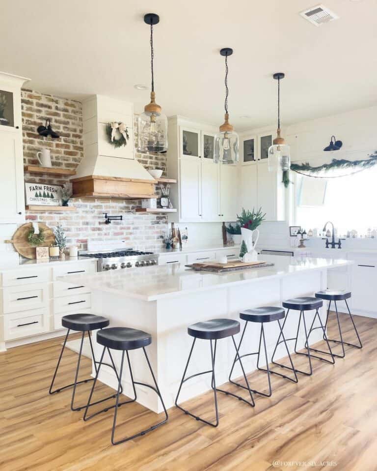 Black Seating Around White Kitchen Island