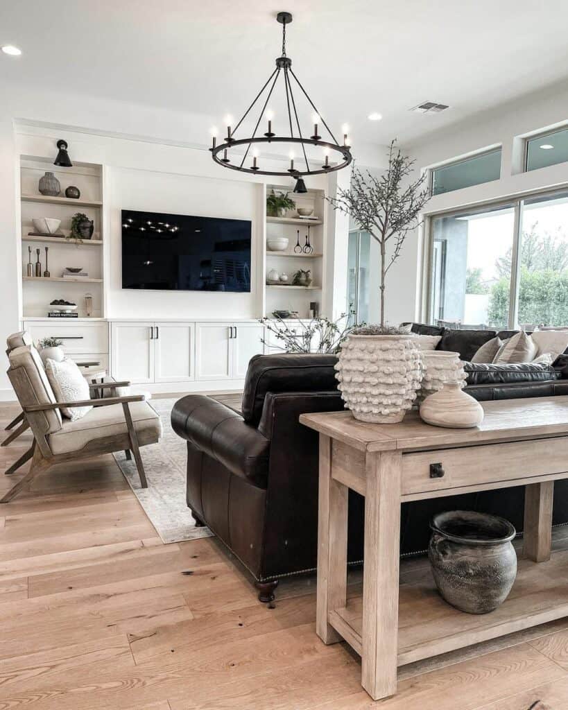 Black Wagon Wheel Chandelier in Well-Lit Living Room