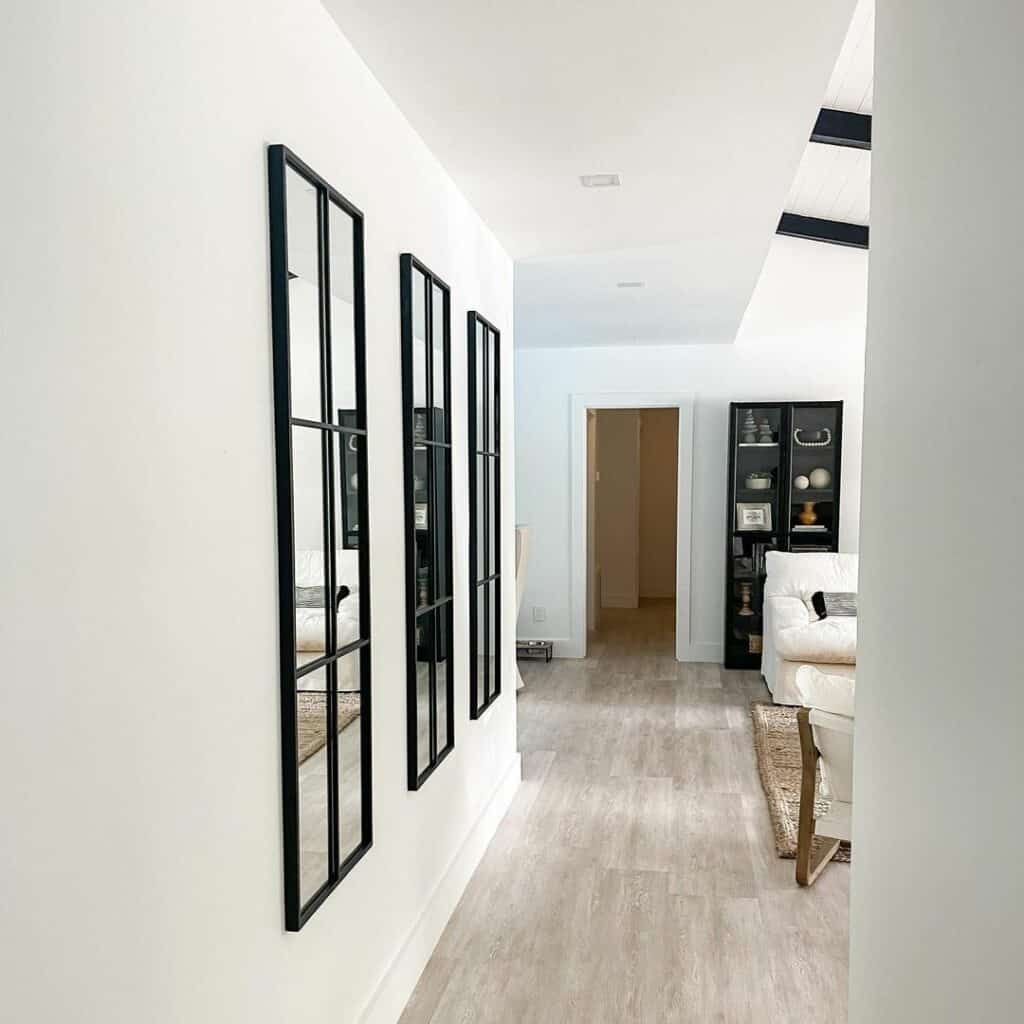 Black Window Frame Mirrors in Hallway with Recessed Lights