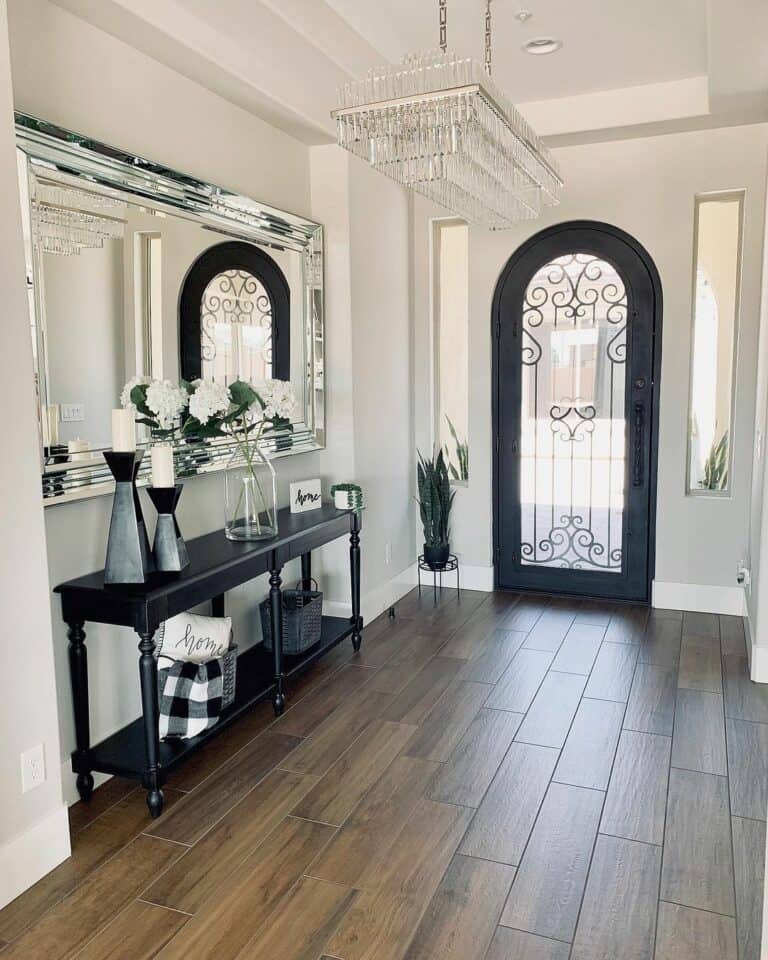Black and White Entryway with Large Mirror