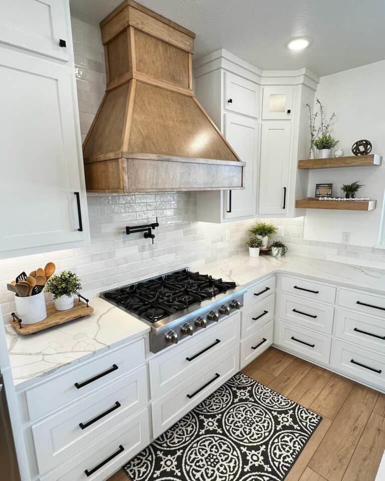 Black and White Kitchen with Wood Range Hood