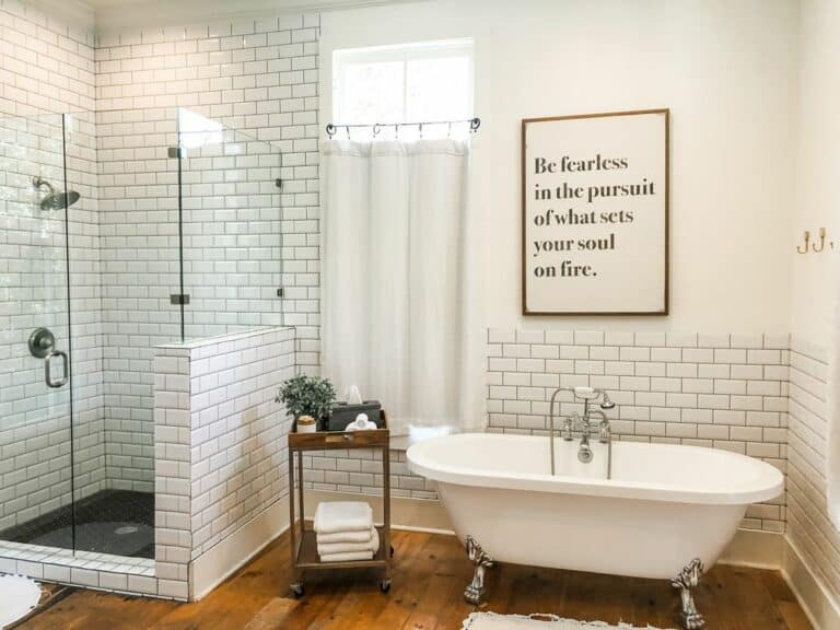 Black and White Tiled Wall Bathroom with Hardwood Floors