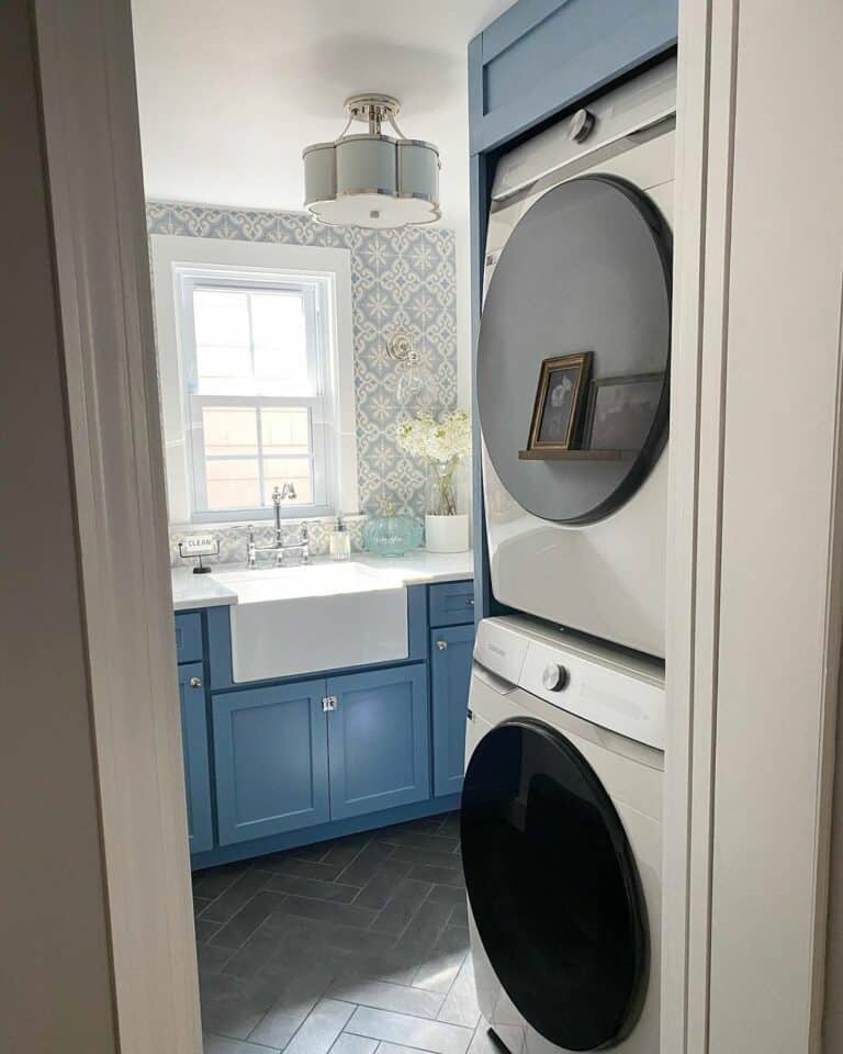 Blue Cabinets and a Gray Herringbone Tile Floor