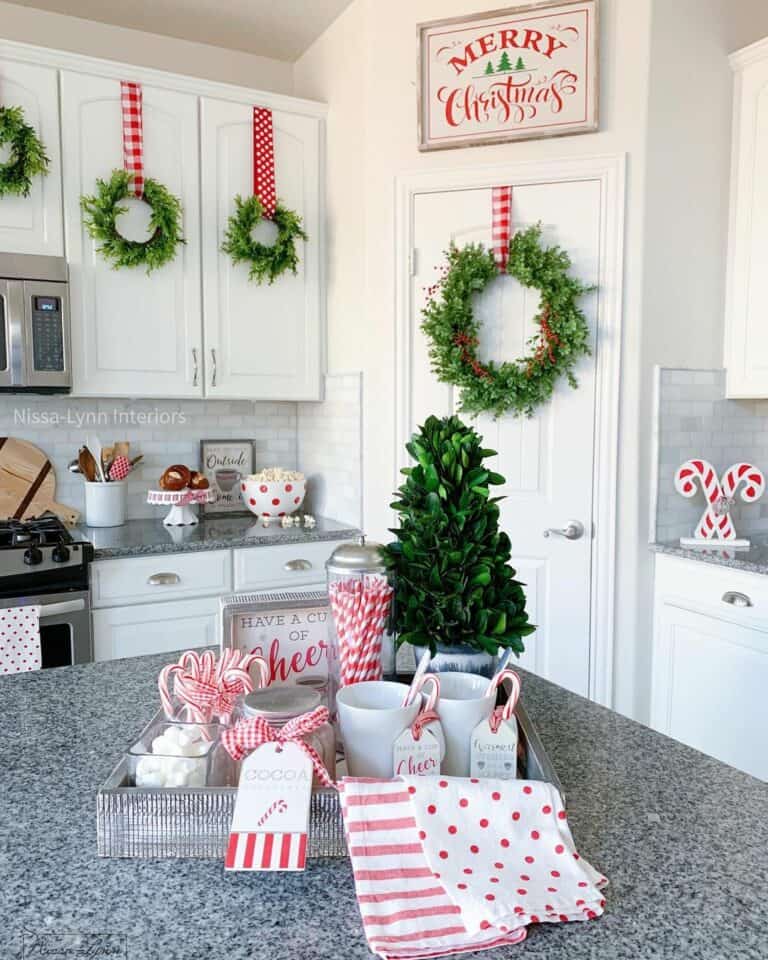 Bright Green Wreaths on White Kitchen Cabinets