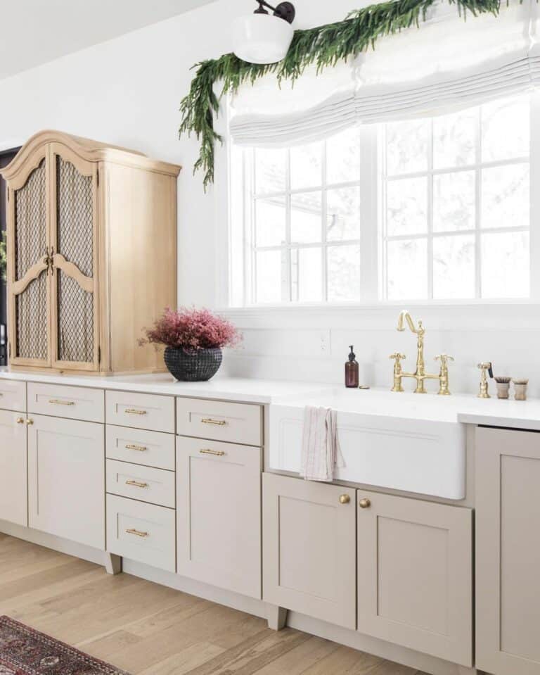 Bright Kitchen with Beige Cabinets and Gold Hardware