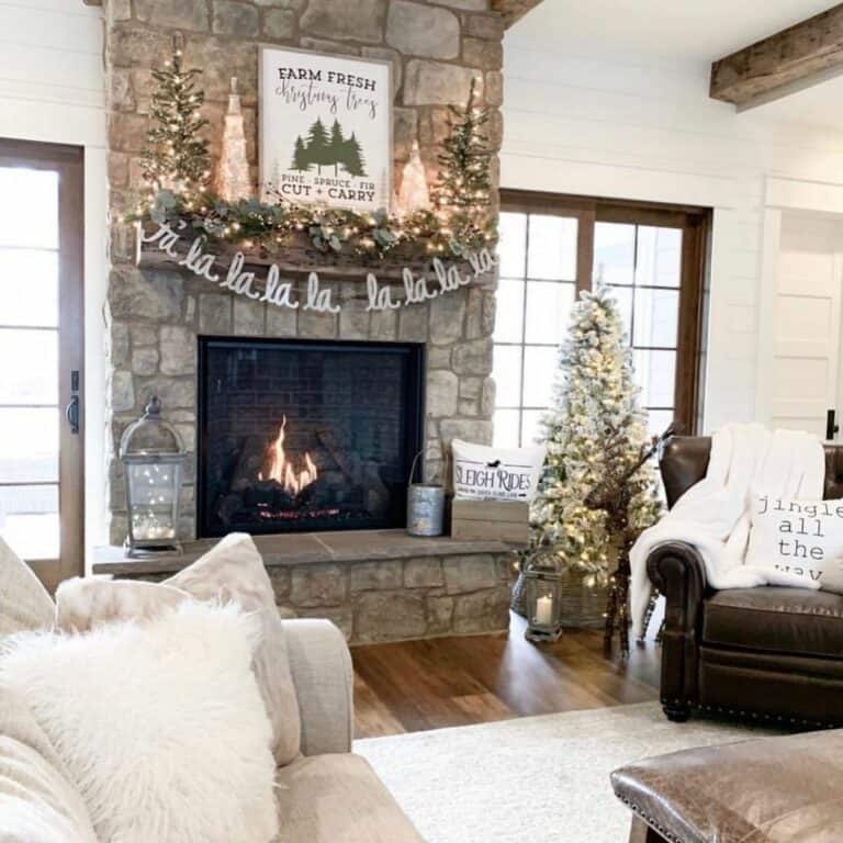 Brightly Lit Christmas Trees on a Wooden Mantel