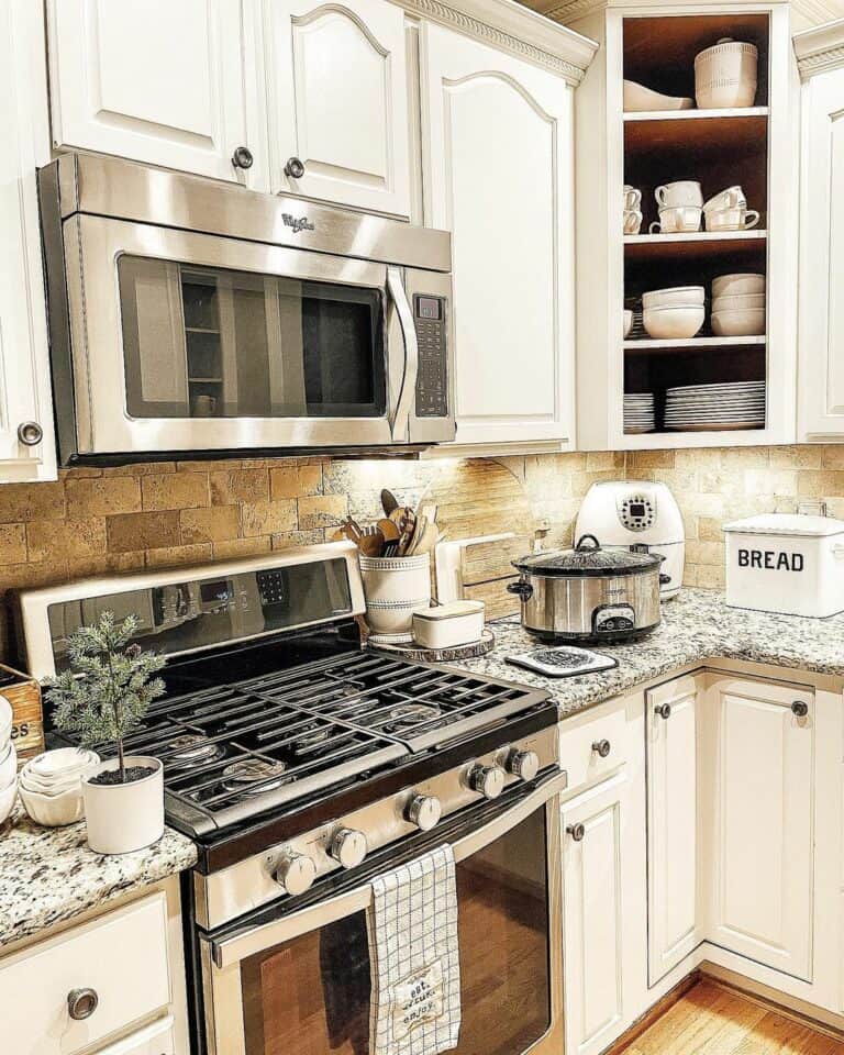 Brown Brick Backsplash and Raised Panel Doors