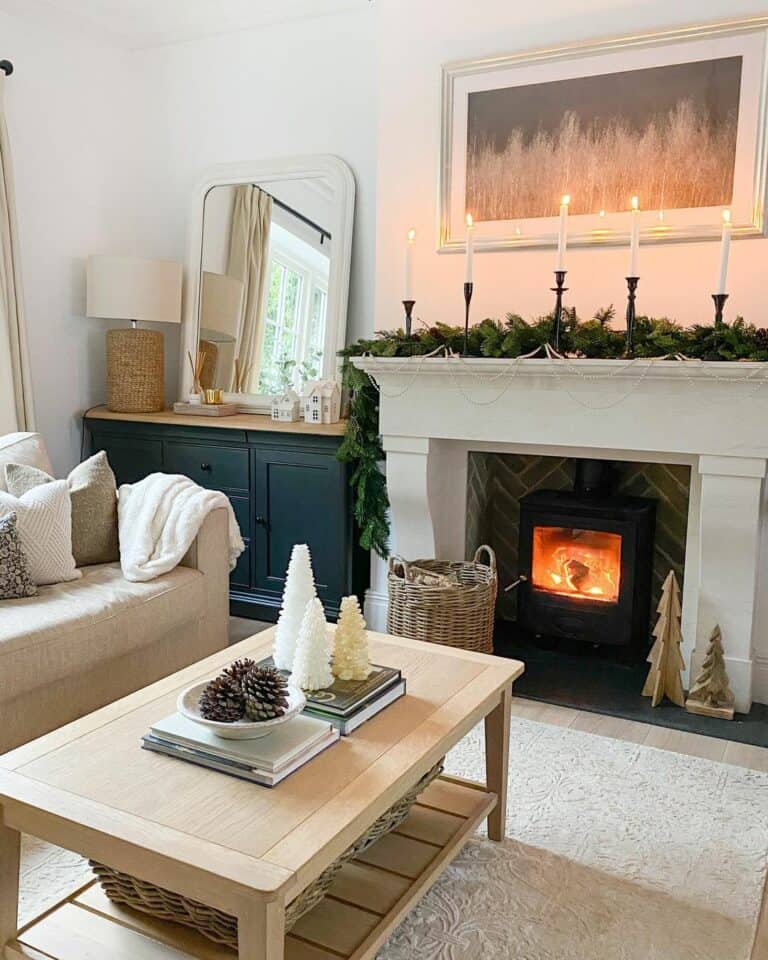 Candles and Fir Garland on White Mantel