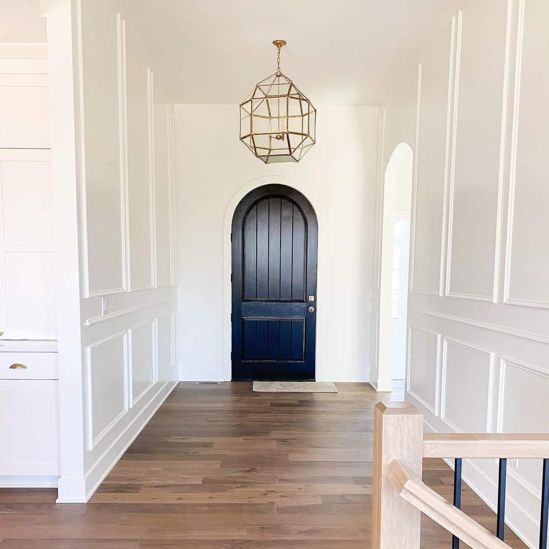 Elegant White Wainscotting with Modern Light Fixture Soul & Lane