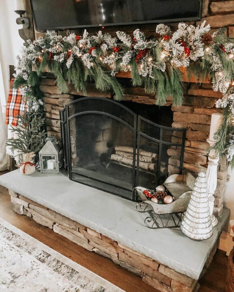 Flocked Garland on Traditional Stone Fireplace