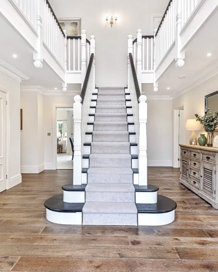 Foyer with Gray Carpet for Stairs