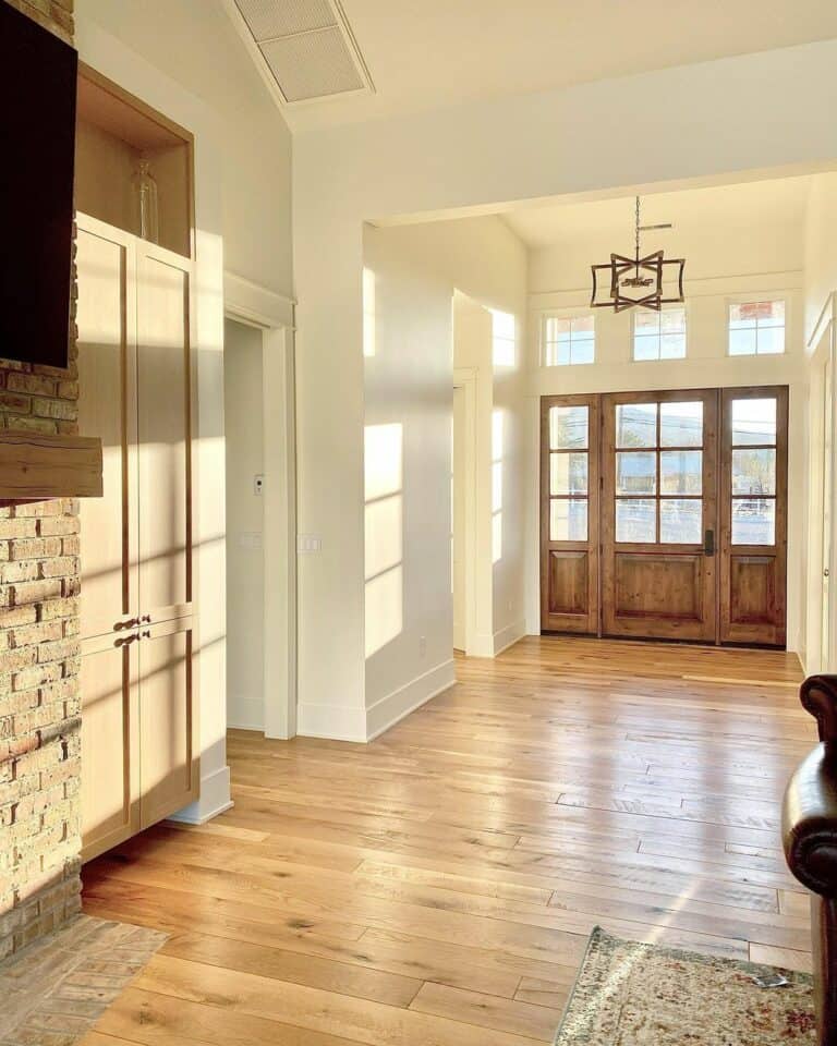 Front Door With Glass Panels in Bright Entryway