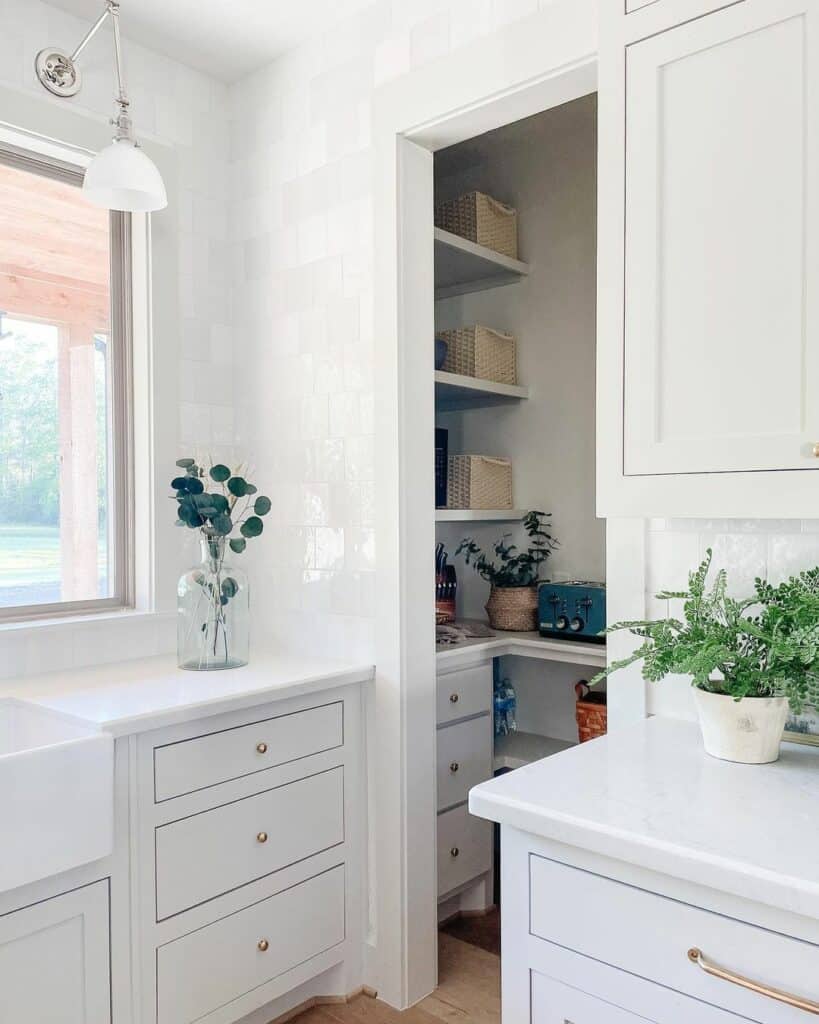 Gold Hardware on White Slab Front Cabinets