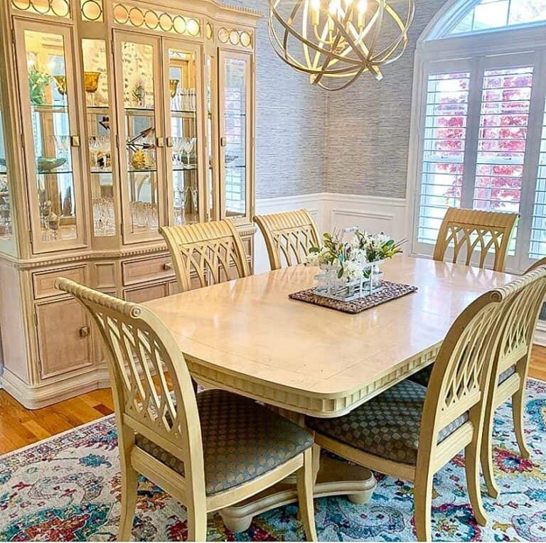 Gold Orb Chandelier Above Dining Table