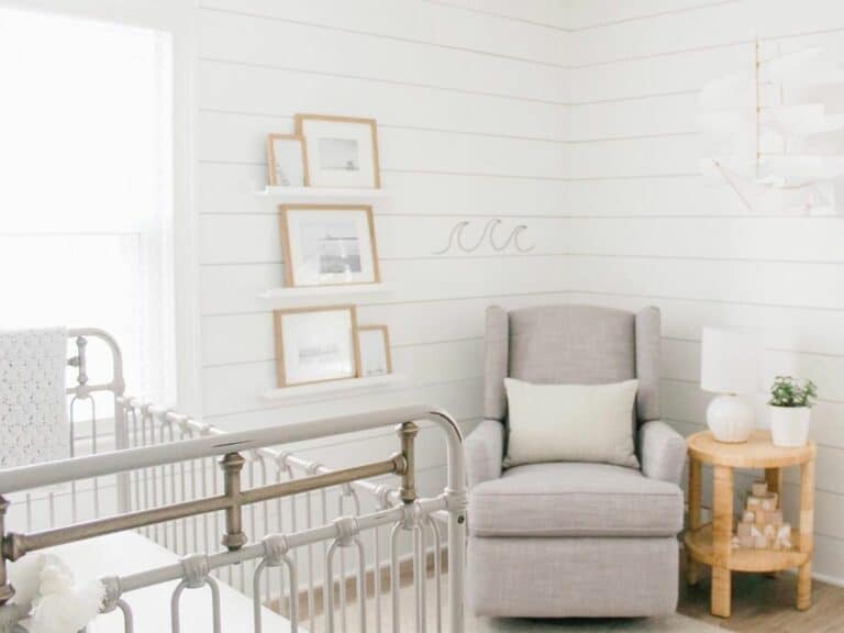 Gray Armchair in a White Shiplap Nursery