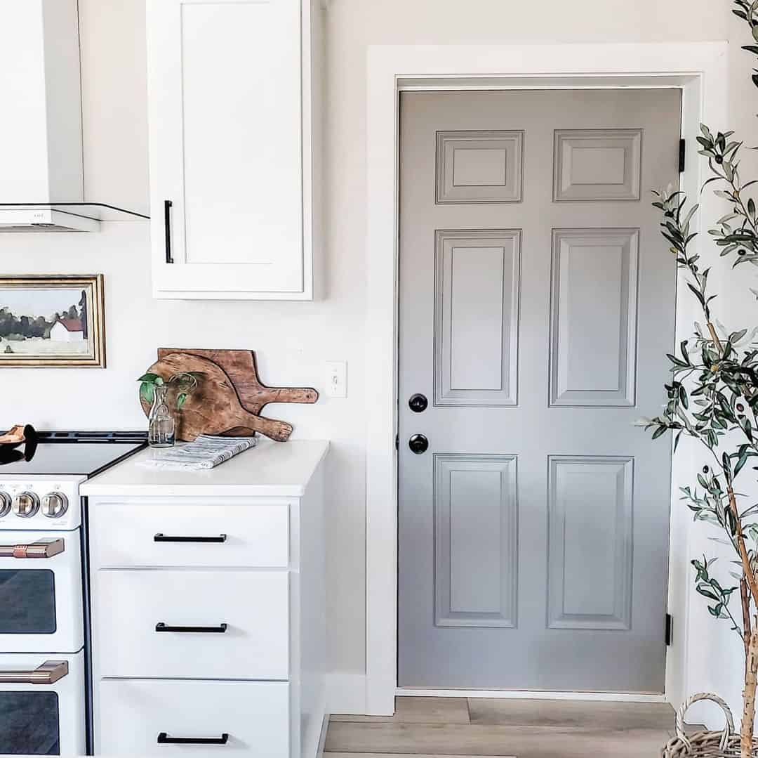 Gray Interior Door with White Trim in White Kitchen - Soul & Lane