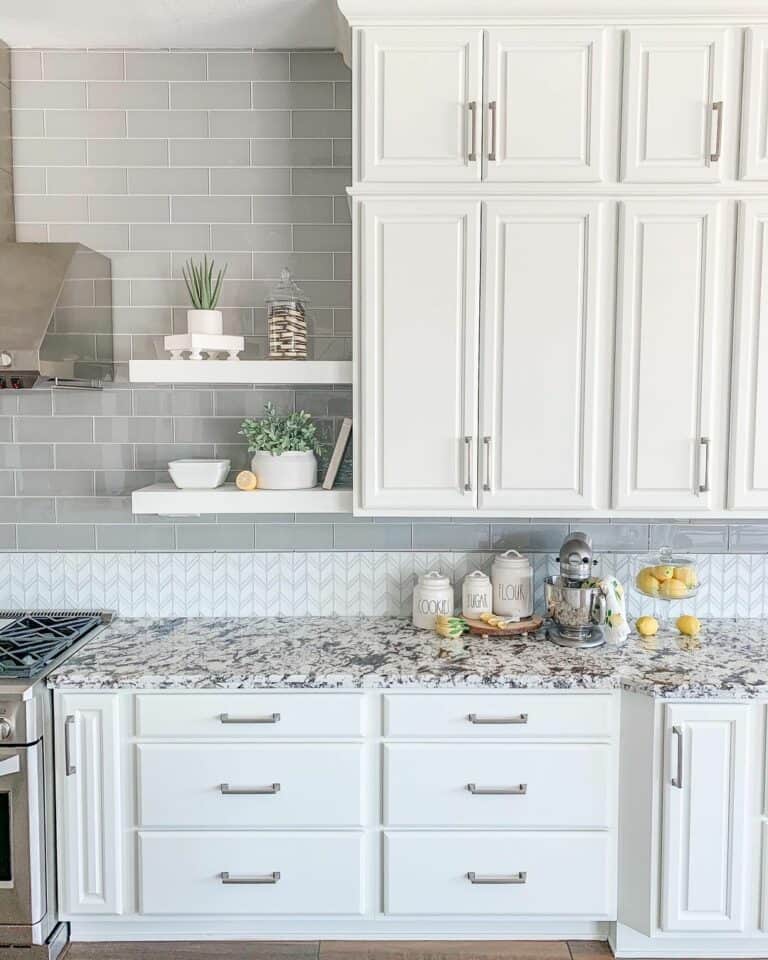 Gray Tile Wall in White Cabinet Kitchen