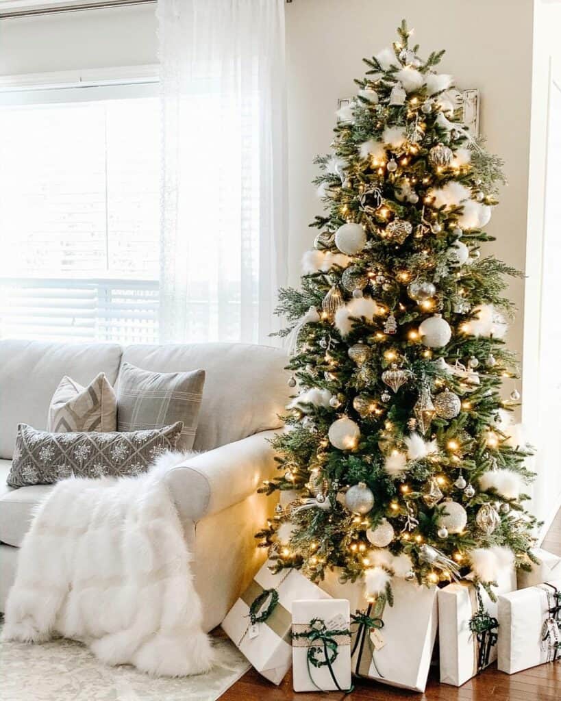 Gray and White Pillows With Christmas Throw